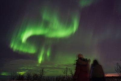 Low angle view of illuminated light against sky at night