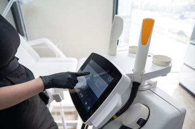 Midsection of man using laptop