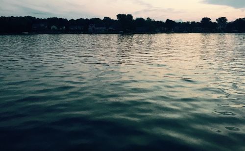 Scenic view of lake at sunset