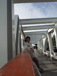 Woman sitting on staircase