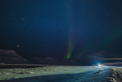 Scenic view of sea against sky at night