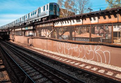 Train at railroad station against sky