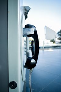 Close-up of telephone booth in city