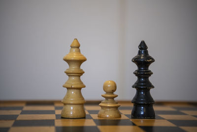 Close-up of chess pieces on table