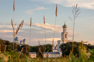Lighthouse and buildings against sky