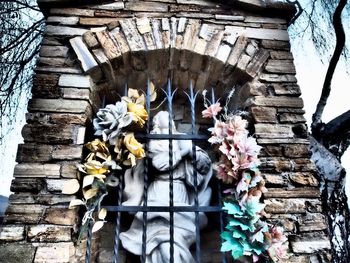 Low angle view of carvings on stone wall