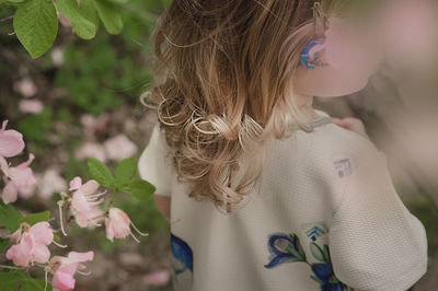 Close-up of girl with pink flowers