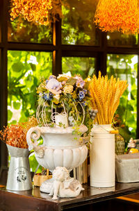 Flowers in glass vase on table