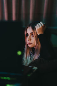 Portrait of young woman using mobile phone