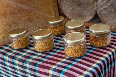 High angle view of candies in jar on table