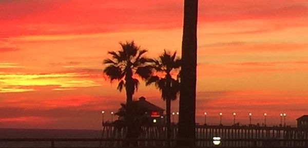 Scenic view of sea against orange sky