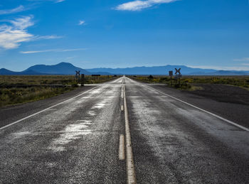 Empty road against sky