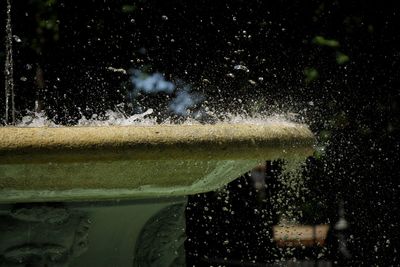 Close-up of water splashing on glass