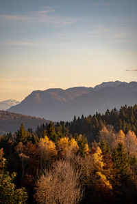 Scenic view of mountains against sky during sunset in autumn