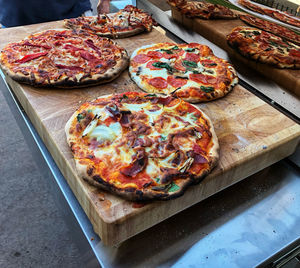 High angle view of pizza on cutting board