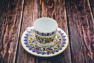 High angle view of coffee cup on table