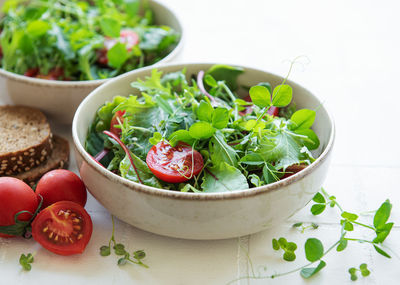 Vegan food healthy fresh vegetables salad. salad with arugula and cherry tomatoes.