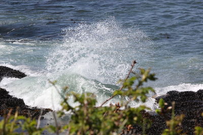 Close-up of waves splashing on sea