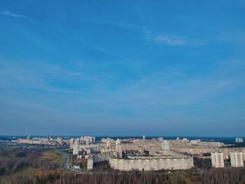 High angle view of townscape against blue sky