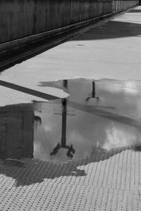 Lamppost reflections on a rainy day 