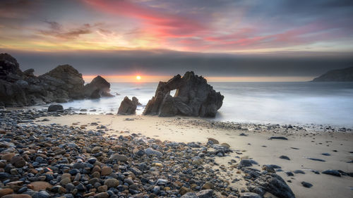 Scenic view of sea against sky during sunset