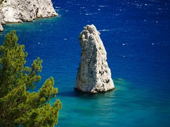 High angle view of rock formation in sea