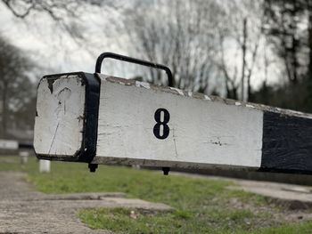 Close-up of empty bench in park