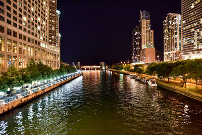 Illuminated buildings in city at night