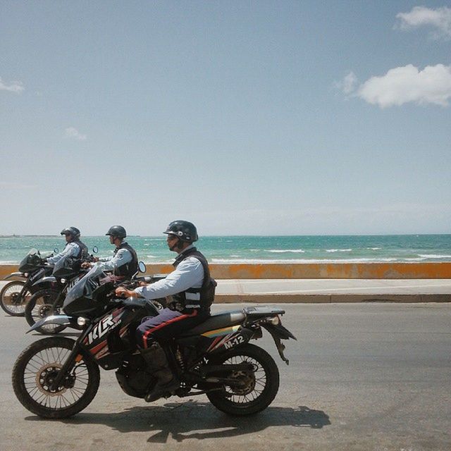 bicycle, transportation, sea, mode of transport, horizon over water, beach, land vehicle, water, sky, shore, travel, lifestyles, leisure activity, riding, men, cycling, stationary, scenics, beauty in nature