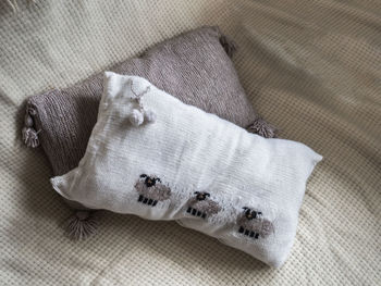 High angle view of pillows on bed at home