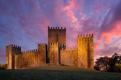 Buildings against sky during sunset