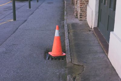 Traffic cone on sewer at road