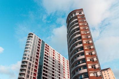 Low angle view of modern buildings against sky