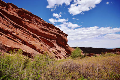 Scenic view of mountain against blue sky