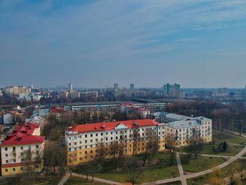 High angle view of buildings in city against sky