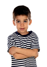 Portrait of boy standing against white background