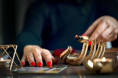 Midsection of man using mobile phone