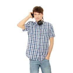 Portrait of boy standing against white background