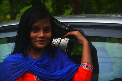 Portrait of beautiful woman in car