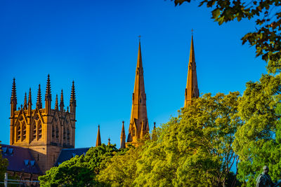 Low angle view of building against clear blue sky