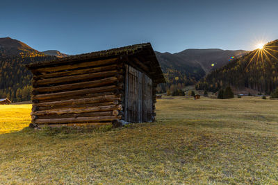 Built structure on field against clear sky