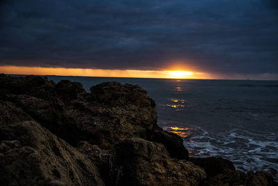 Scenic view of sea against sky during sunset