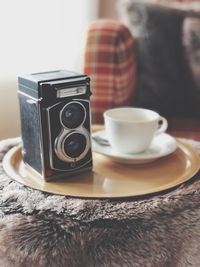 Close-up of coffee cup on table