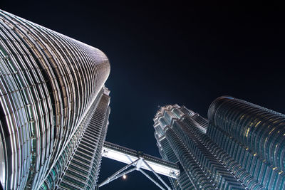 Low angle view of illuminated building at night