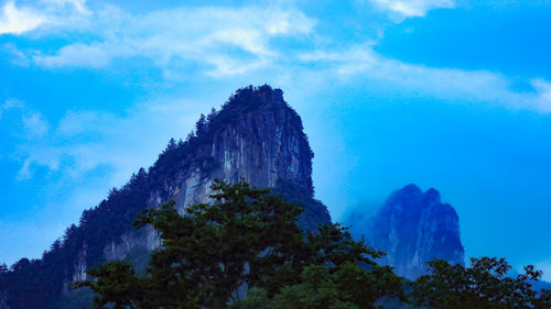 Low angle view of rock formation against sky