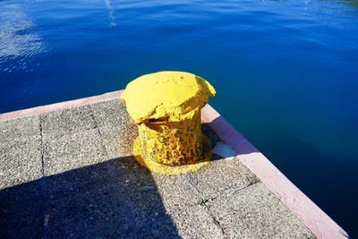 High angle view of yellow retaining wall by swimming pool