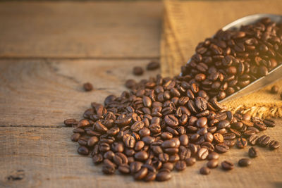 Close-up of roasted coffee beans on table