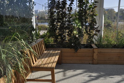 Empty chairs and tables by window