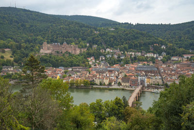 High angle view of river by townscape against sky