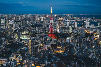 Aerial view of city lit up at night